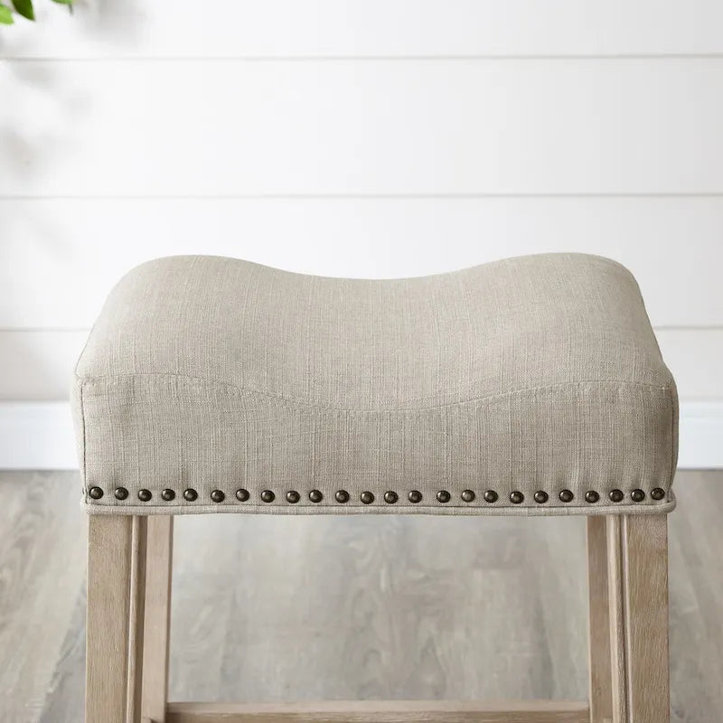 Taburete de mostrador con asiento tapizado tipo silla de montar, ribete con tachuelas, patas de madera de caucho, sin respaldo